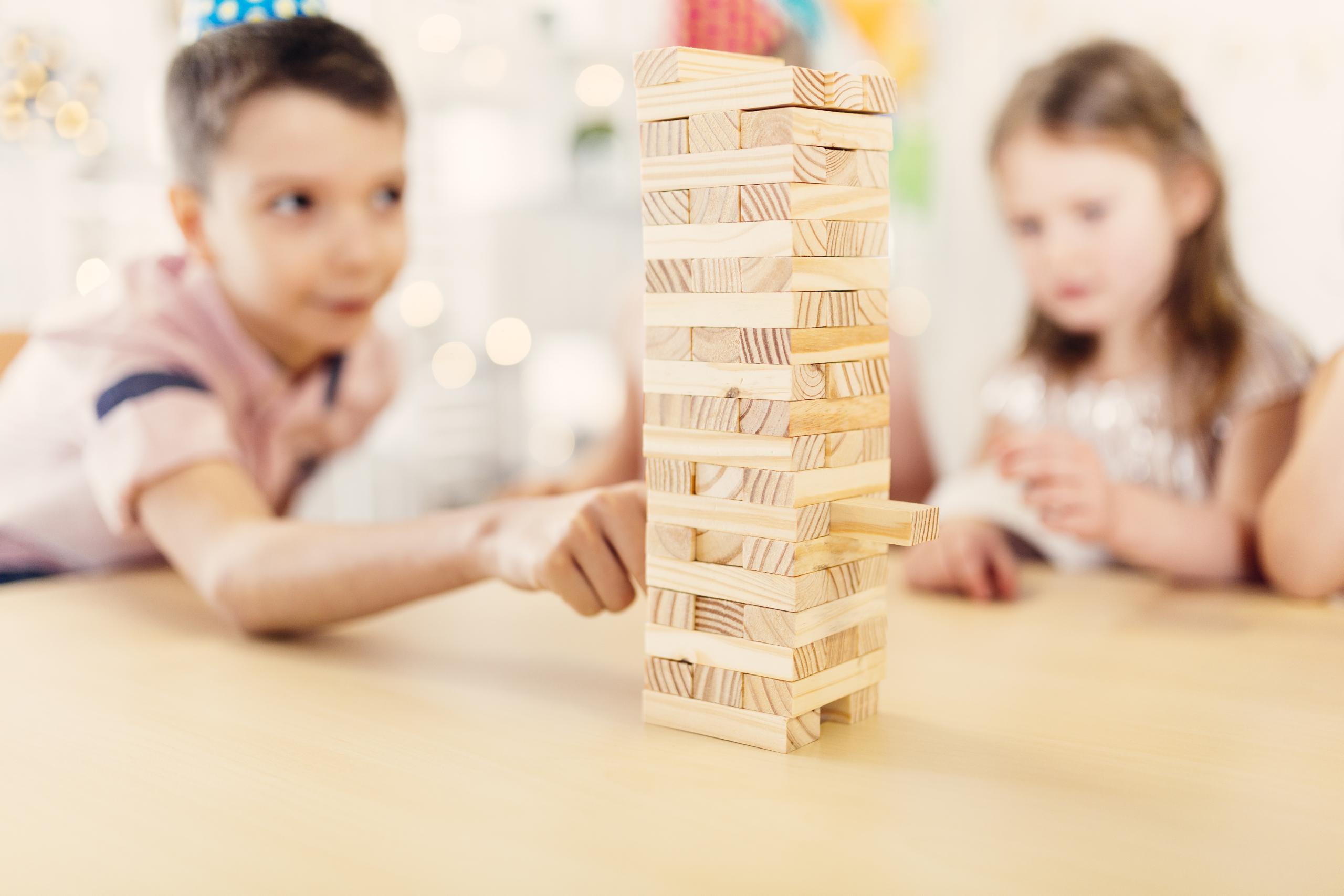 boy-girl-playing-wooden-game